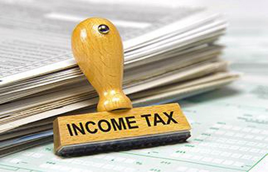 What are the tax rates under the old tax regime and the new tax regime?